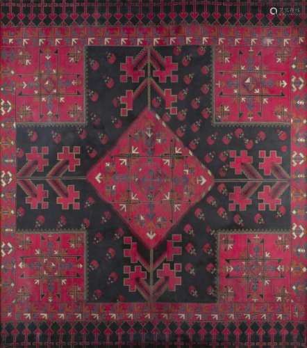 Tissu encadré à décor cousu en croix d'Asie centrale.