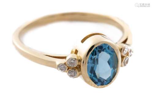 Bague en or jaune .750 sertie d'une topaze bleue