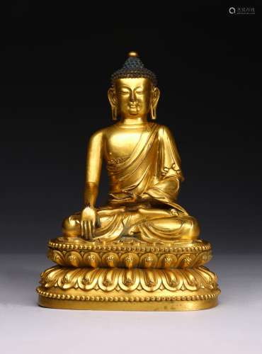 A GILT BRONZE FIGURE OF SEATED SHAKYAMUNI