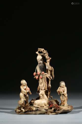 A SHOUSHAN STONE CARVED FIGURAL GROUP