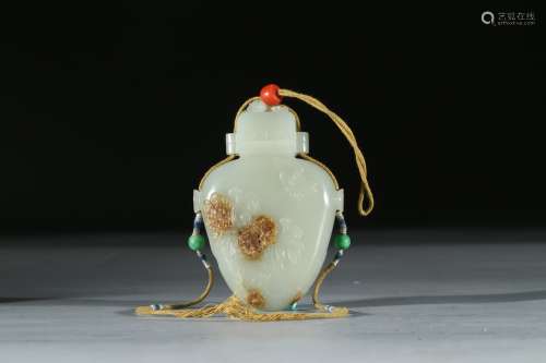 A WHITE JADE 'FLOWERS AND BEE' POMANDER