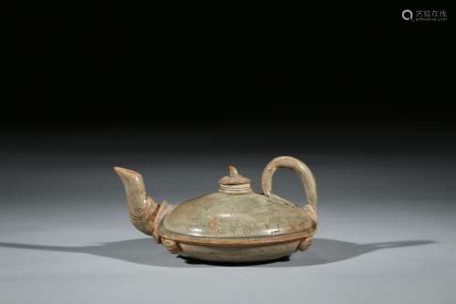 A CELADON INCISED COMPRESSED TEAPOT