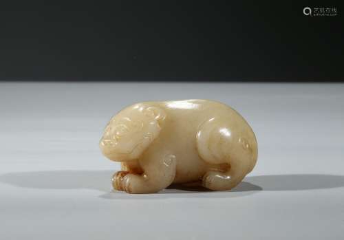 A CARVED YELLOW JADE BEAR
