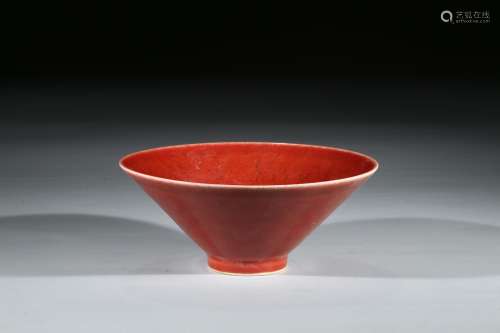 A RED GLAZED CONICAL BOWL