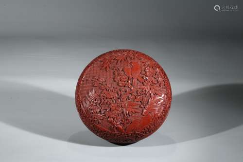 A CINNABAR LACQUER CARVED BOX AND COVER