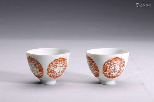 A PAIR OF RED GLAZED MEDALLION CUPS