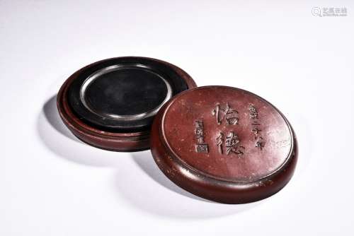 A CIRCULAR INKSTONE WITH CASE