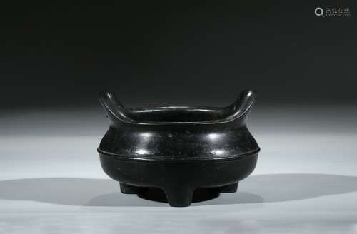 A BRONZE TRIPOD CENSER