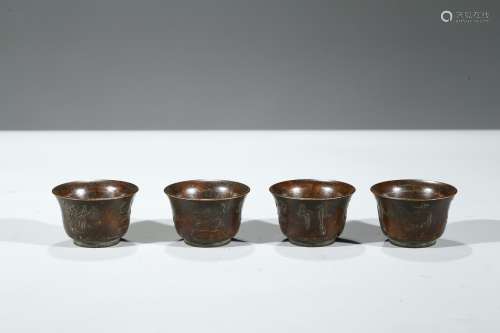 A GROUP OF FOUR BRONZE CUPS