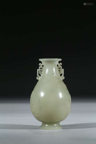 A CELADON JADE CARVED VASE