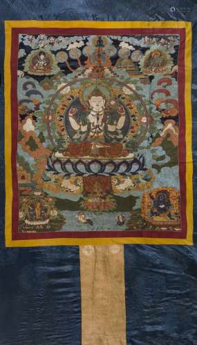 AN EMBROIDERED SILK 'FOUR-ARMED BODHISATTVA' THANGKA