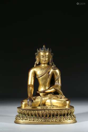 A GILT BRONZE FIGURE OF SEATED SHAKYAMUNI