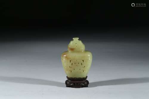 A SMALL YELLOW JADE RETICULATED VASE WITH STAND