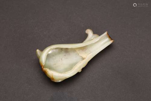 A SMALL JADE CARVED WASHER