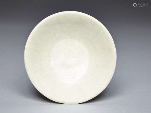 A WHITE GLAZED DISH