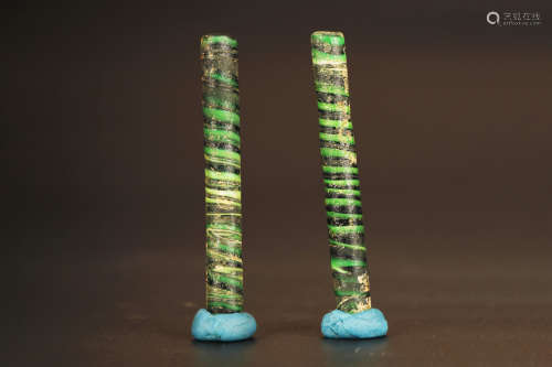 TWO HAN DYNASTY PERIOD SPIRAL GLASS TUBE ORNAMENTS
