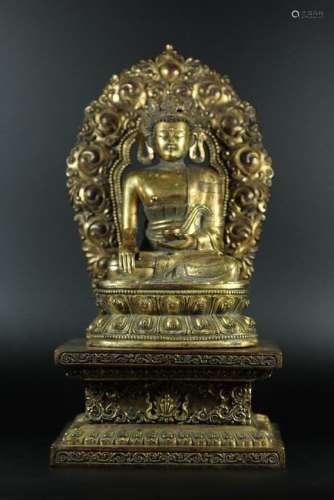 A GILT-BRONZE FIGURE OF SEATING SAKYAMUNI.MING DYNASTY