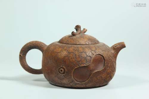 A CARVED YIXING TEAPOT AND COVER.ANTIQUE