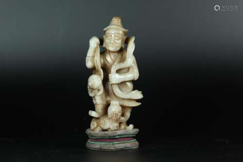 A CARVED WHITE JADE FOREIGNER. ANTIQUE