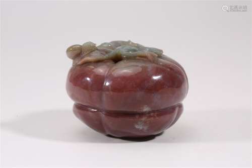 A CARVED AGATE PERSIMMON.