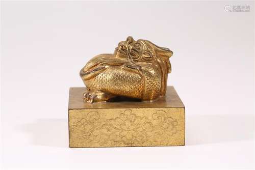 A CARVED GILT-BRONZE DRAGON SEAL.ANTIQUE