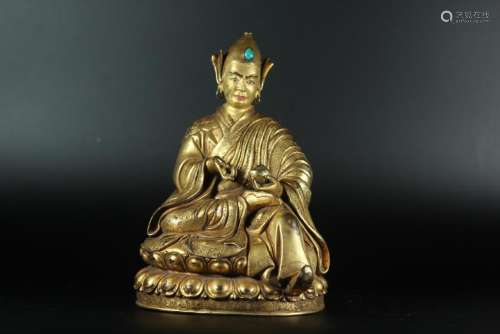 A GILT-BRONZE FIGURE OF GURU.QING DYNASTY