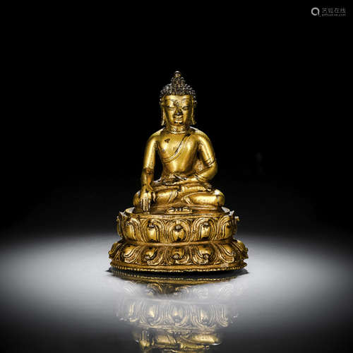 A GILT-BRONZE FIGURE OF BUDDHA SHAKYAMUNI