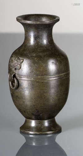 A SMALL BRONZE VASE WITH TAOTIE MASK HANDLES