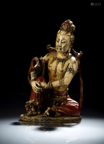 AN IMPORTANT GILT- AND RED-LACQUERED IVORY FIGURE OF GUANYIN
