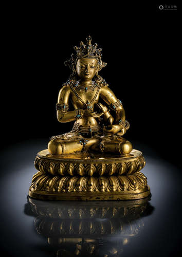 A RARE GILT-BRONZE FIGURE OF MAHASIDDHA GRUB.CHAN.KU.KU.RIG.PA