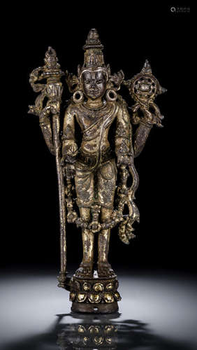 A FINE AND RARE SILVER INLAID GILT-BRONZE FIGURE OF VISHNU