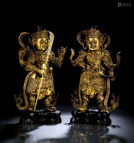 A FINE AND RARE PAIR OF GILT-BRONZE GUARDIANS