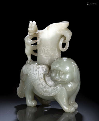 A WELL CARVED LIGHT CELADON JADE MYTHICAL BEAST WITH RHYTON AND DRAGON