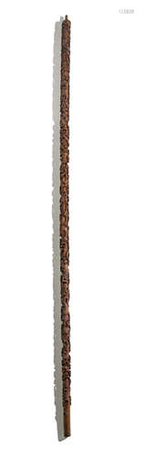 A LARGE SANDLEWOOD CARVED STAFF WITH BATS AND SYMBOLS