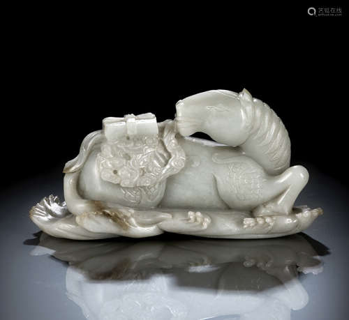 A RARE AND LARGE NEAR WHITE JADE CARVING OF A MYTHICAL HORSE