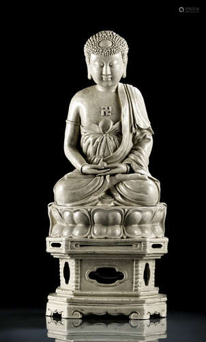 A LARGE ZHANGZHOU-WARE FIGURE OF BUDDHA SHAKYAMUNI SEATED ON A THRONE