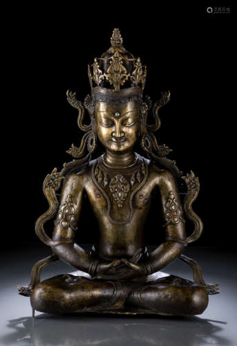 AN IMPORTANT SILVER- AND COPPER-INLAID BRONZE FIGURE OF AMITABHA