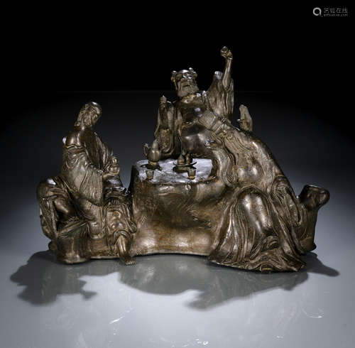 AN UNUSUAL BRONZE GROUP OF DRINKING IMMORTALS