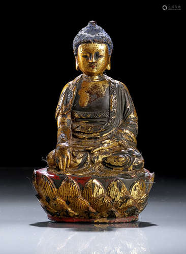 A GILT- AND RED-LACQUERED BRONZE FIGURE OF BUDDHA SHAKYAMUNI