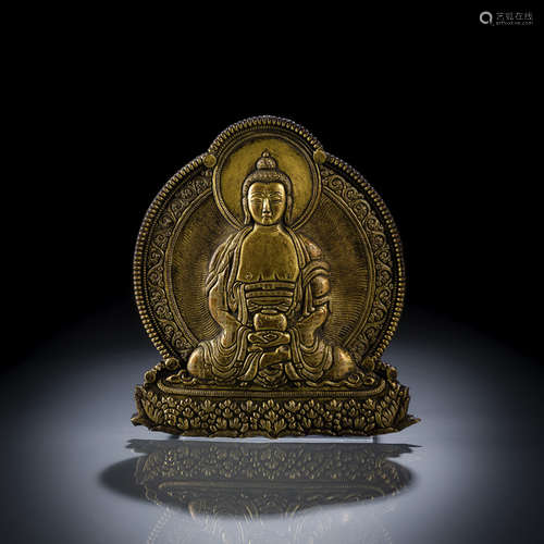 AN EMBOSSED GILT-BRONZE PLAQUE DEPICTING BUDDHA SHAKYAMUNI