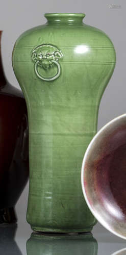 A GREEN-GLAZED VASE WITH LION'S HEAD HANDLES