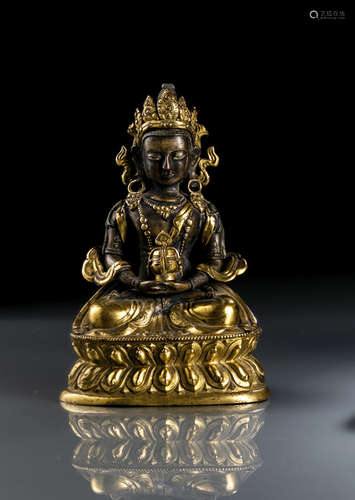 A PARCEL GILT-BRONZE FIGURE OF AMITAYUS