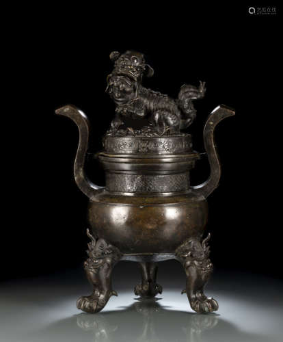 A LARGE BRONZE CENSER AND COVER WITH LION HANDLE