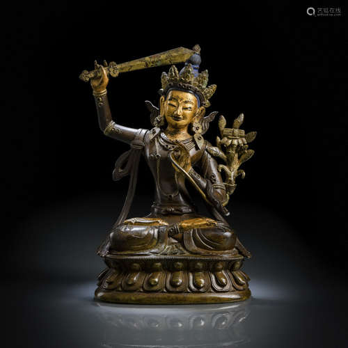 A BRONZE FIGURE OF MANJUSHRI