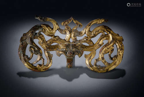 A GILT-BRONZE ORNAMENT