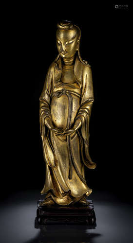 A GILT-BRONZE FIGURE OF AN IMMORTAL