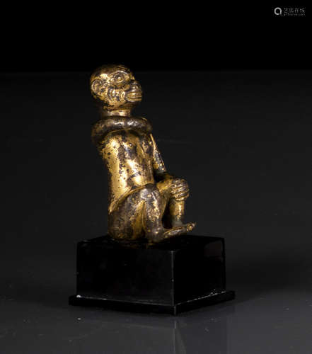 A GILT-BRONZE FIGURE OF A MONKEY