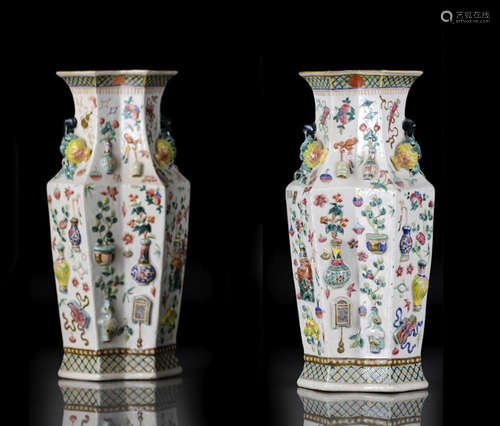 A PAIR OF OCTAGONAL FAMILLE ROSE RELIEF VASES