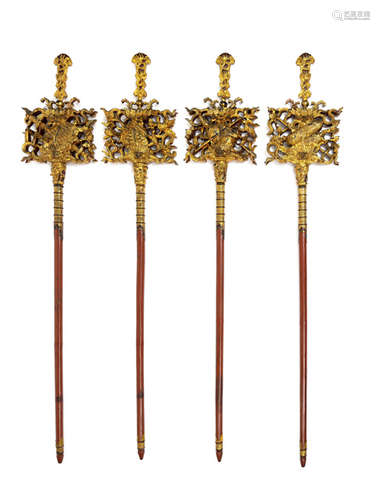 A GROUP OF EIGHT CARVED AND LACQUER-GILDED BUDDHIST EMBLEMS HALBERDS