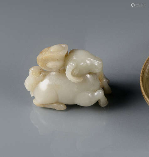 A WELL CARVED JADE GROUP OF TWO RAMS